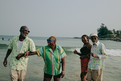 A group of people standing on top of a beach