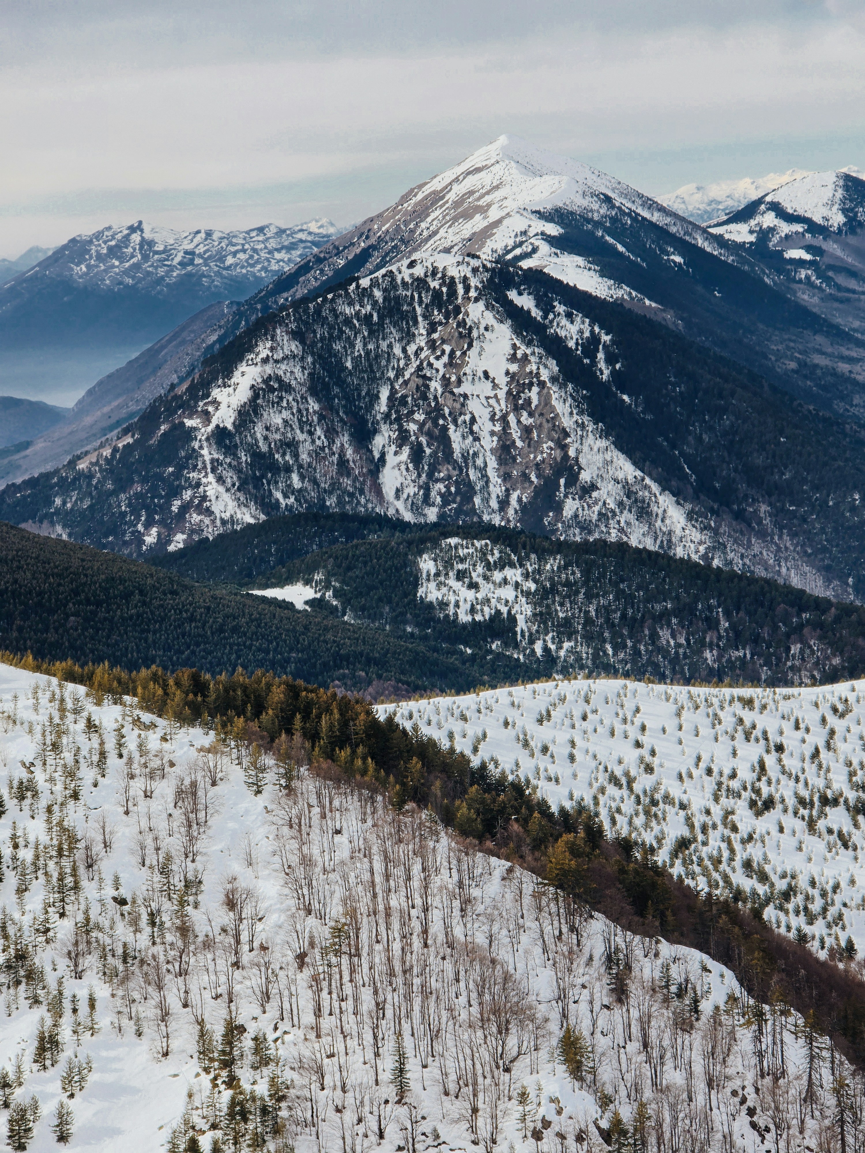 A view of a snowy mountain range from a distance