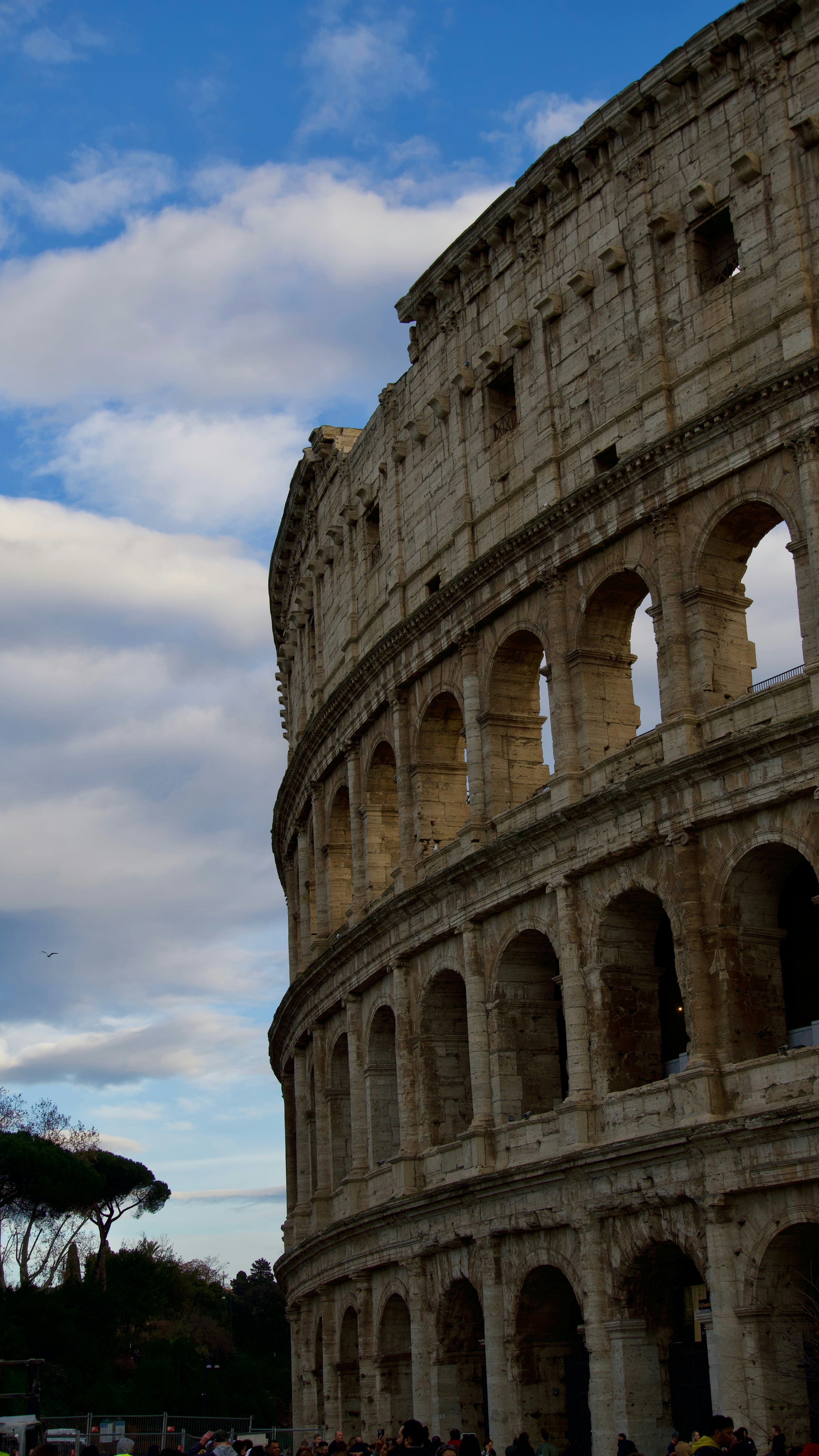 A group of people standing in front of an old building