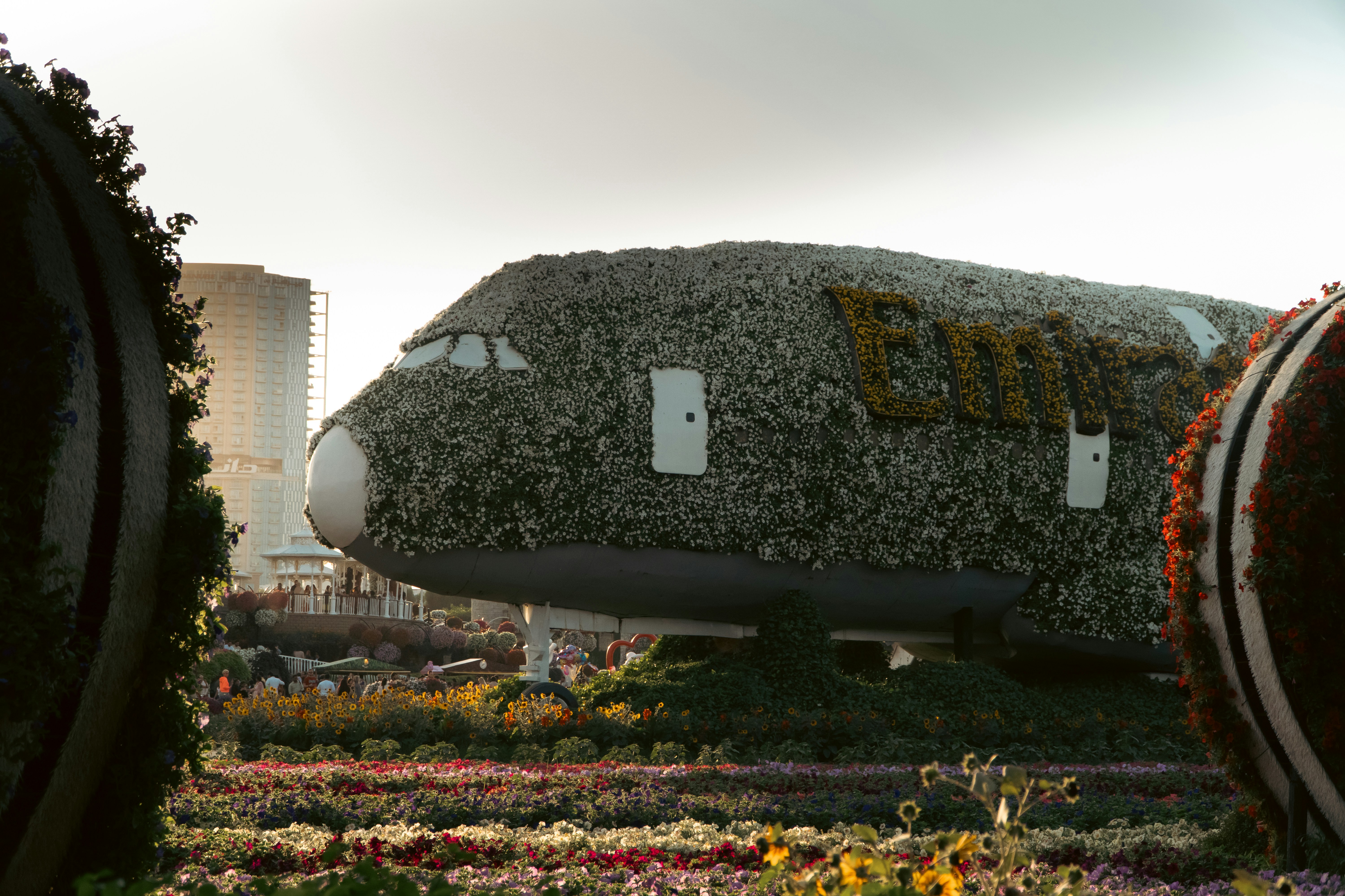 woman wearing yellow long-sleeved dress under white clouds and blue sky during daytime