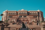 A large building with a long walkway leading to it