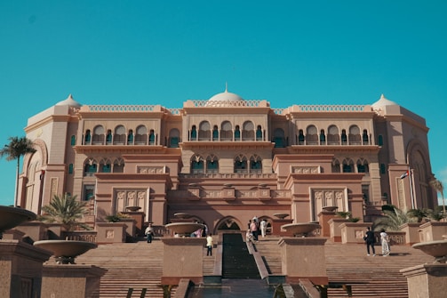 A large building with a long walkway leading to it
