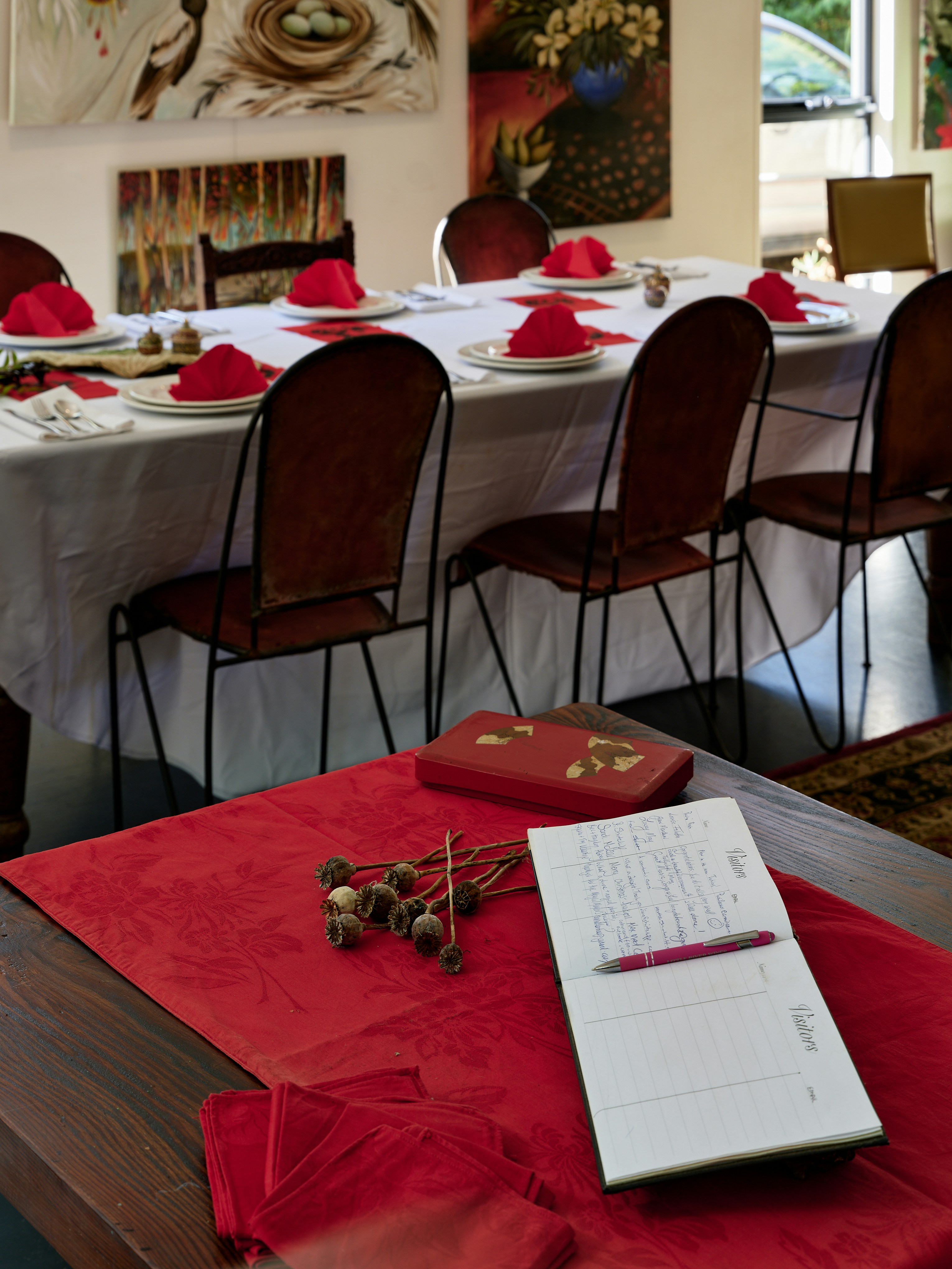 A dining room with a table set for a formal function