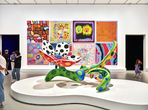 A group of people looking at art on display