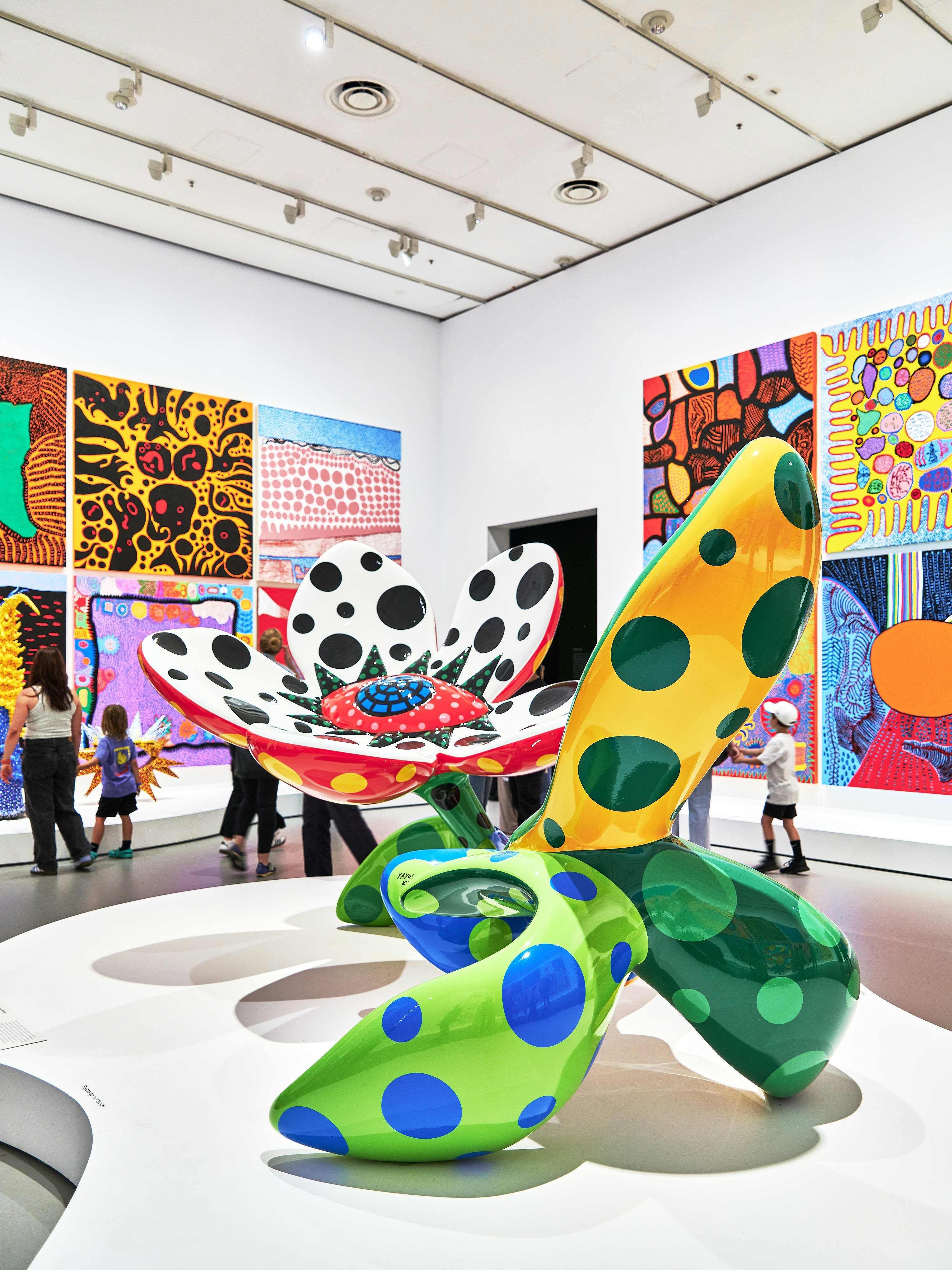 A group of people looking at art on display