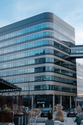 A large building with many windows in front of it