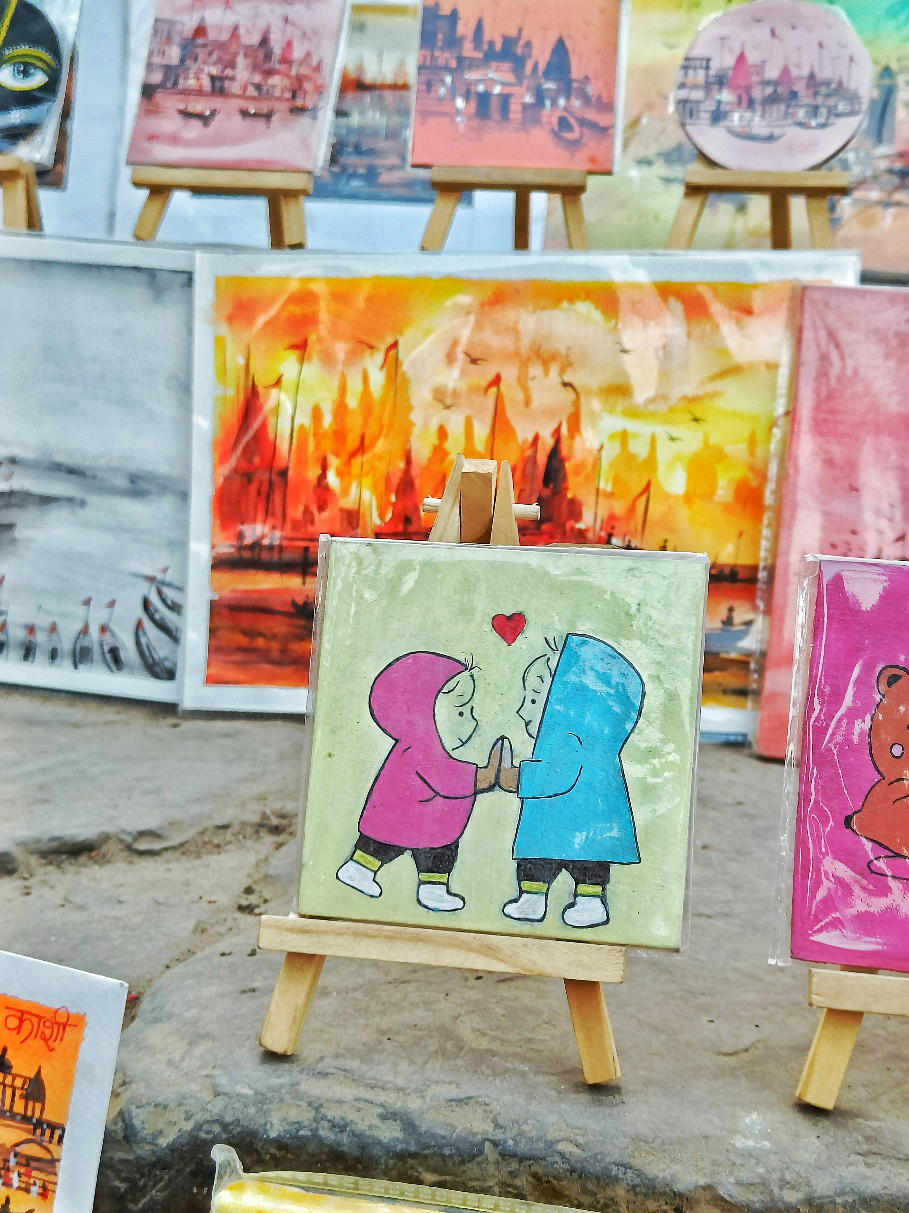 A table topped with paintings of cartoon characters