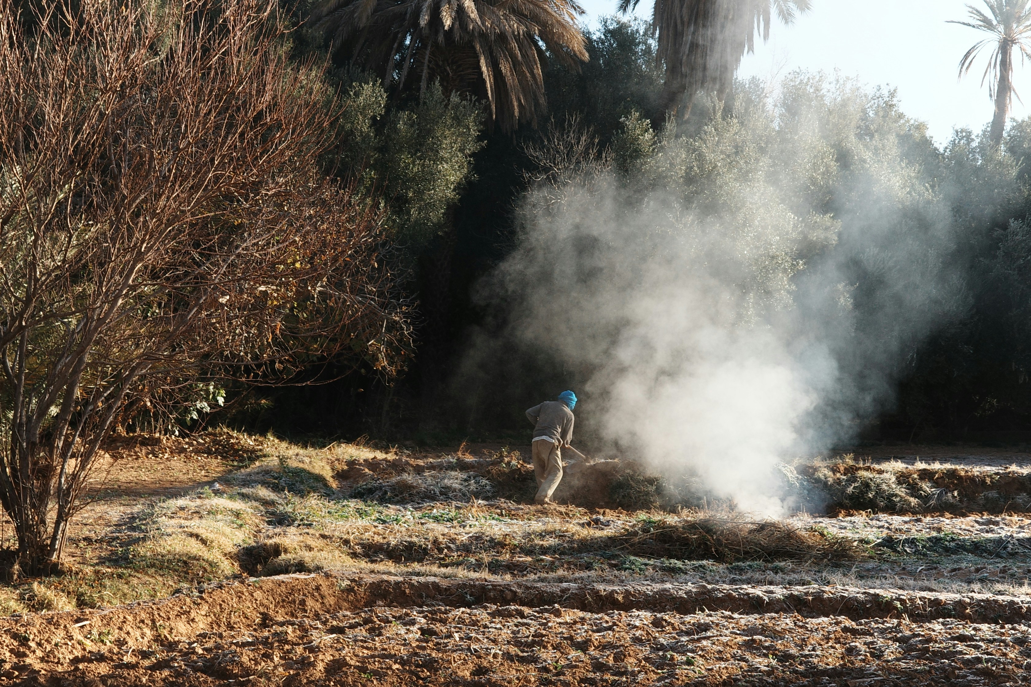 A man riding a bike down a dirt road
