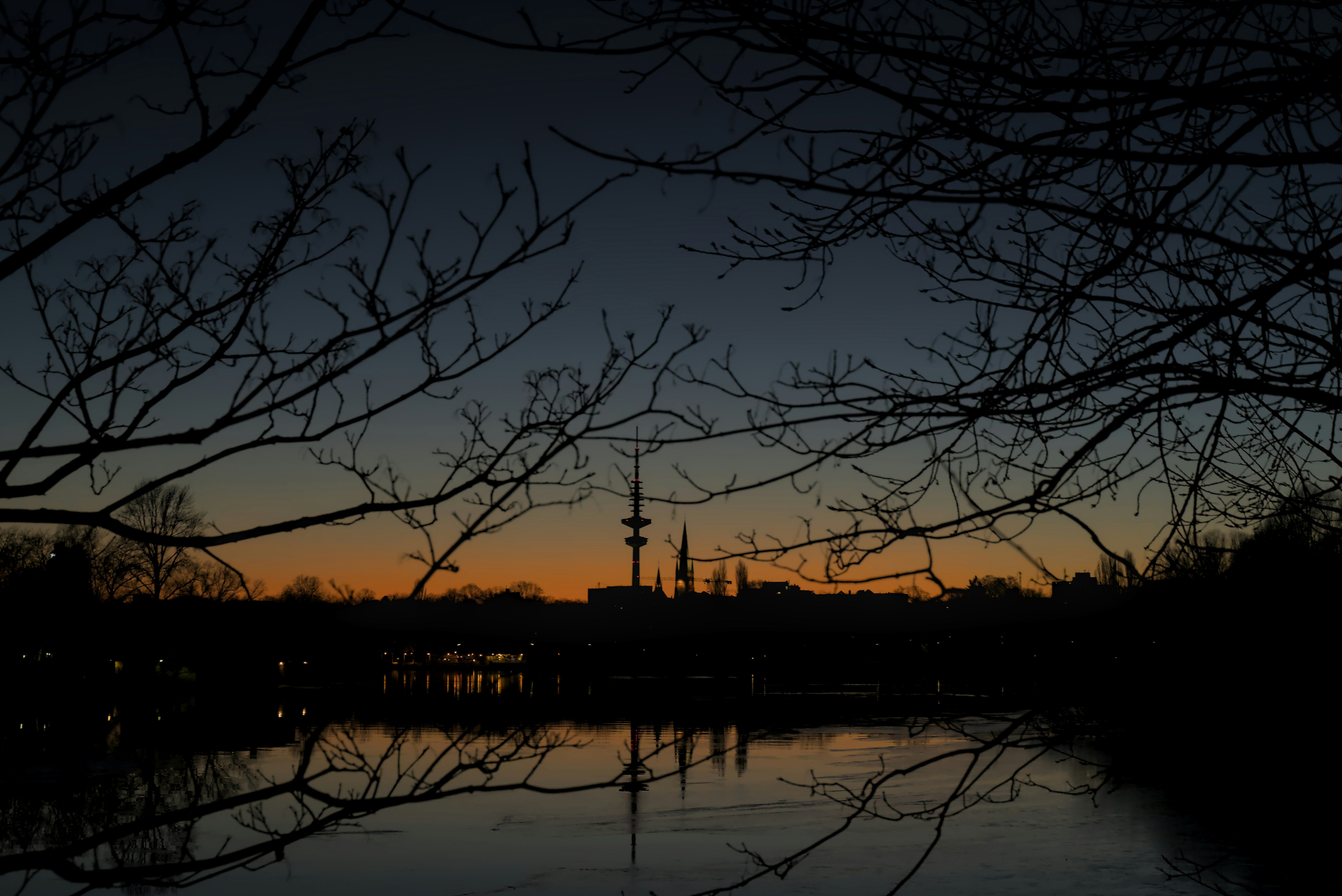 The sun is setting over a body of water