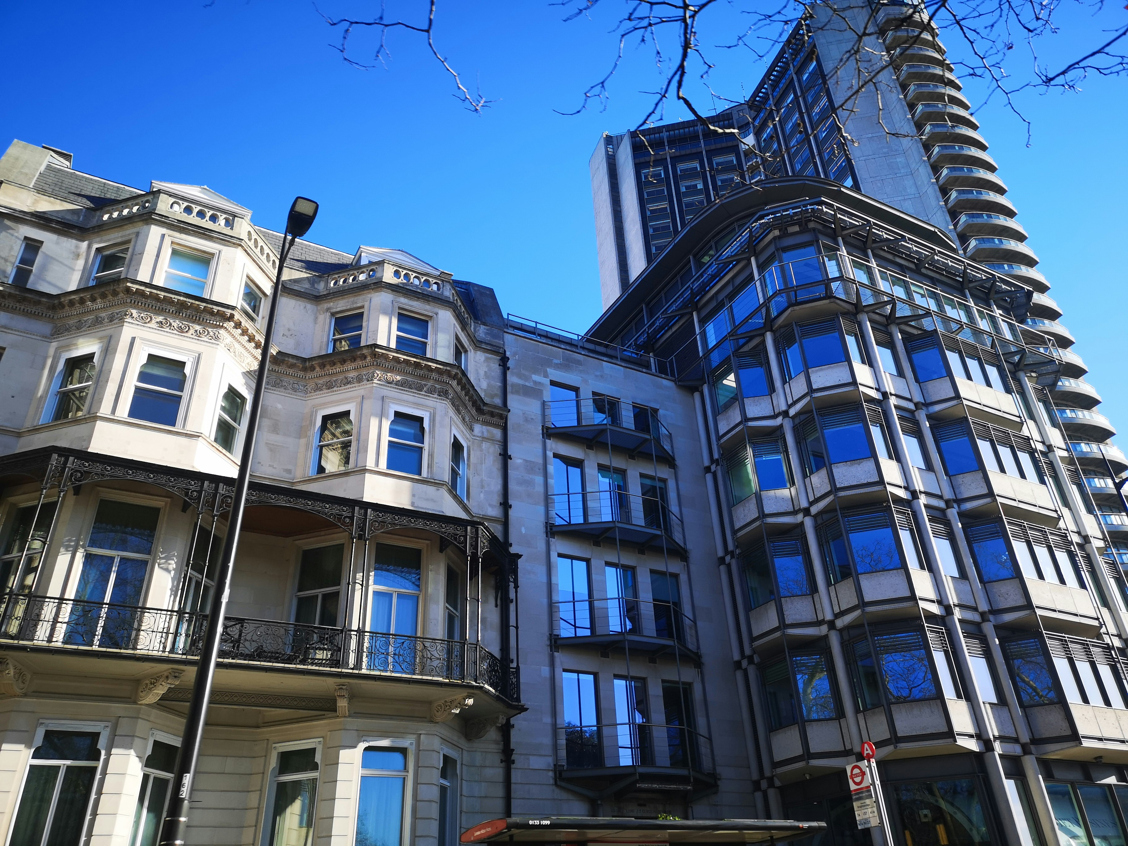 Classic Victorian greystone next to a modern apartment building in Wicker Park - apartment buildings in wicker park