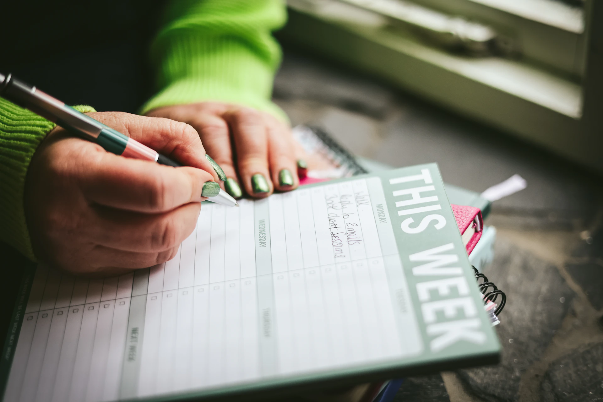 A person writing on a piece of paper