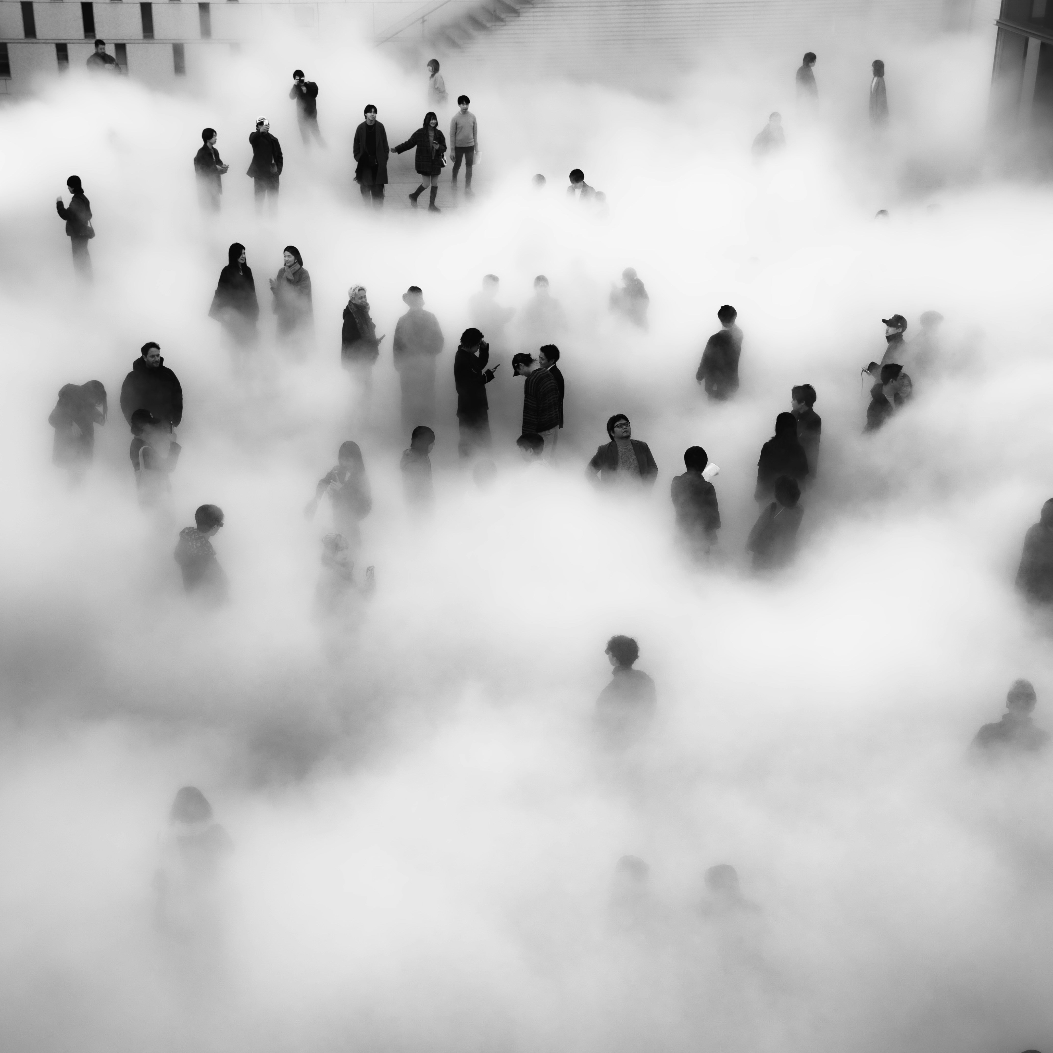 A group of people standing in a foggy area