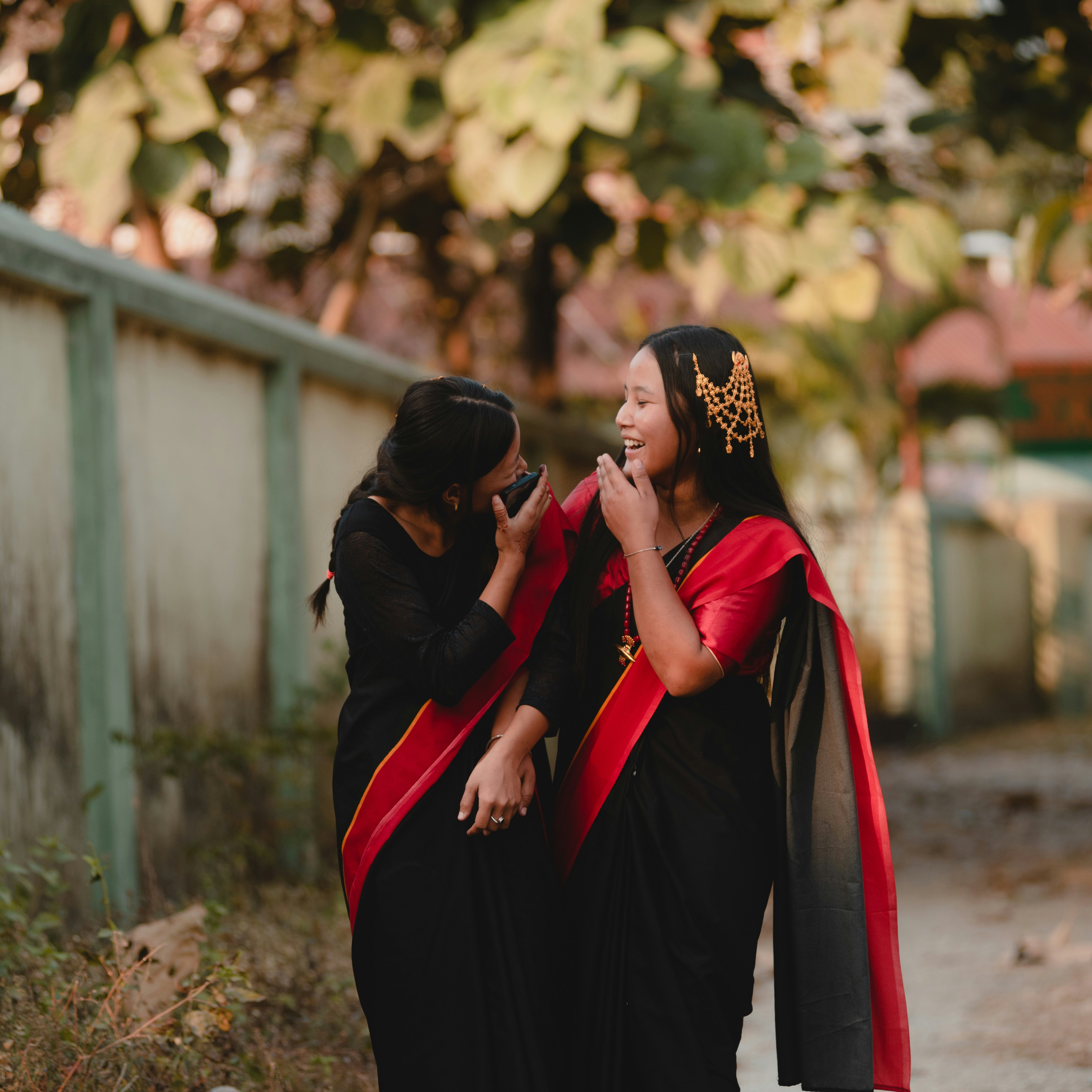 A couple of women standing next to each other