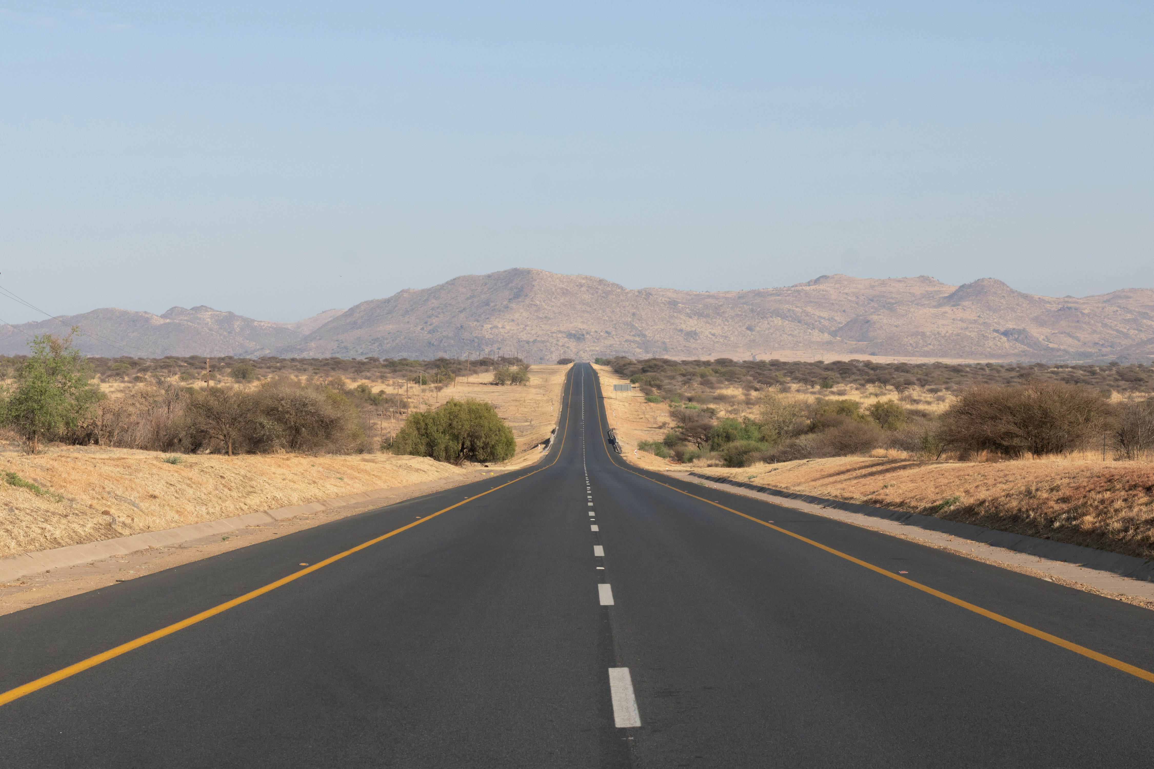An empty road in the middle of the desert