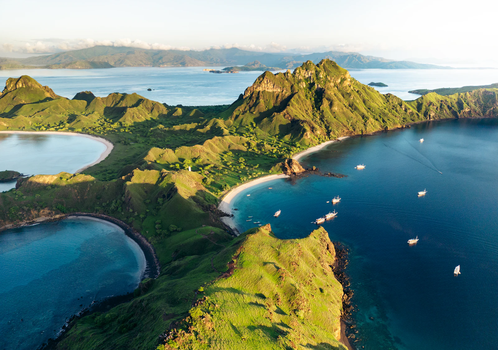 Traditional Phinisi sailing boat anchored off Padar Island
