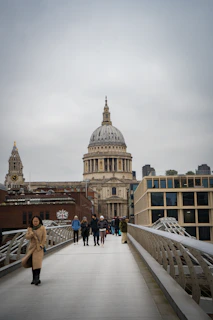 A group of people walking across a bridge
