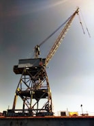A large crane sitting on top of a bridge