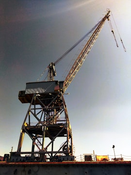 A large crane sitting on top of a bridge