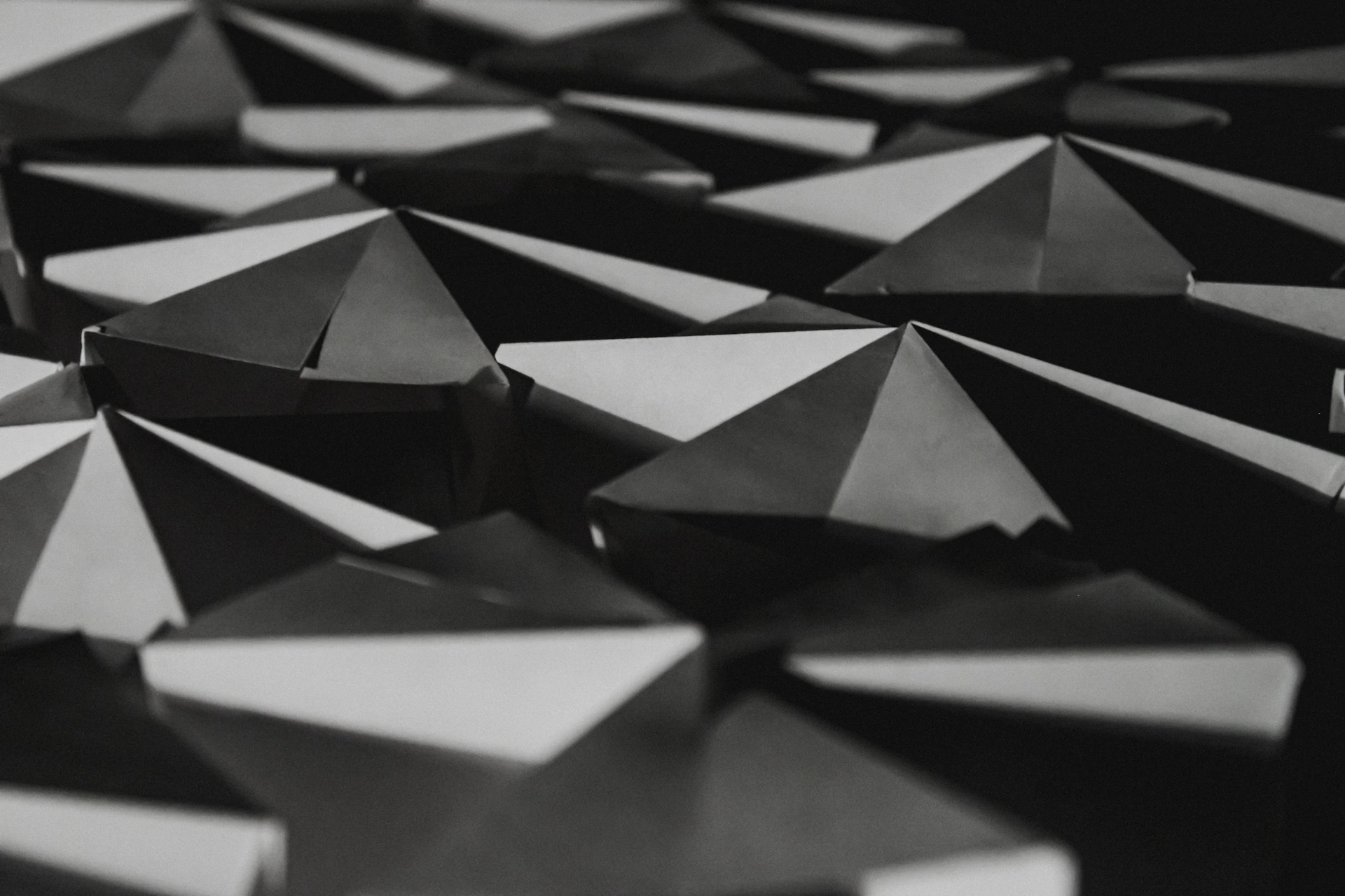 A black and white photo of a bunch of umbrellas