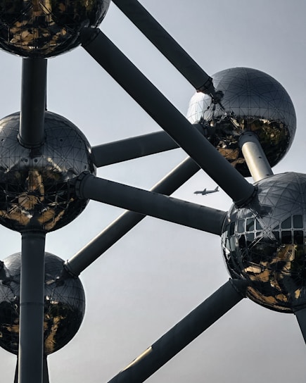 A large metal structure with lots of balls on top of it