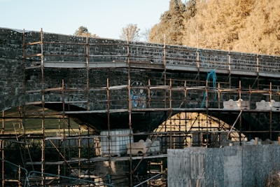 A bridge with scaffolding on the side of it
