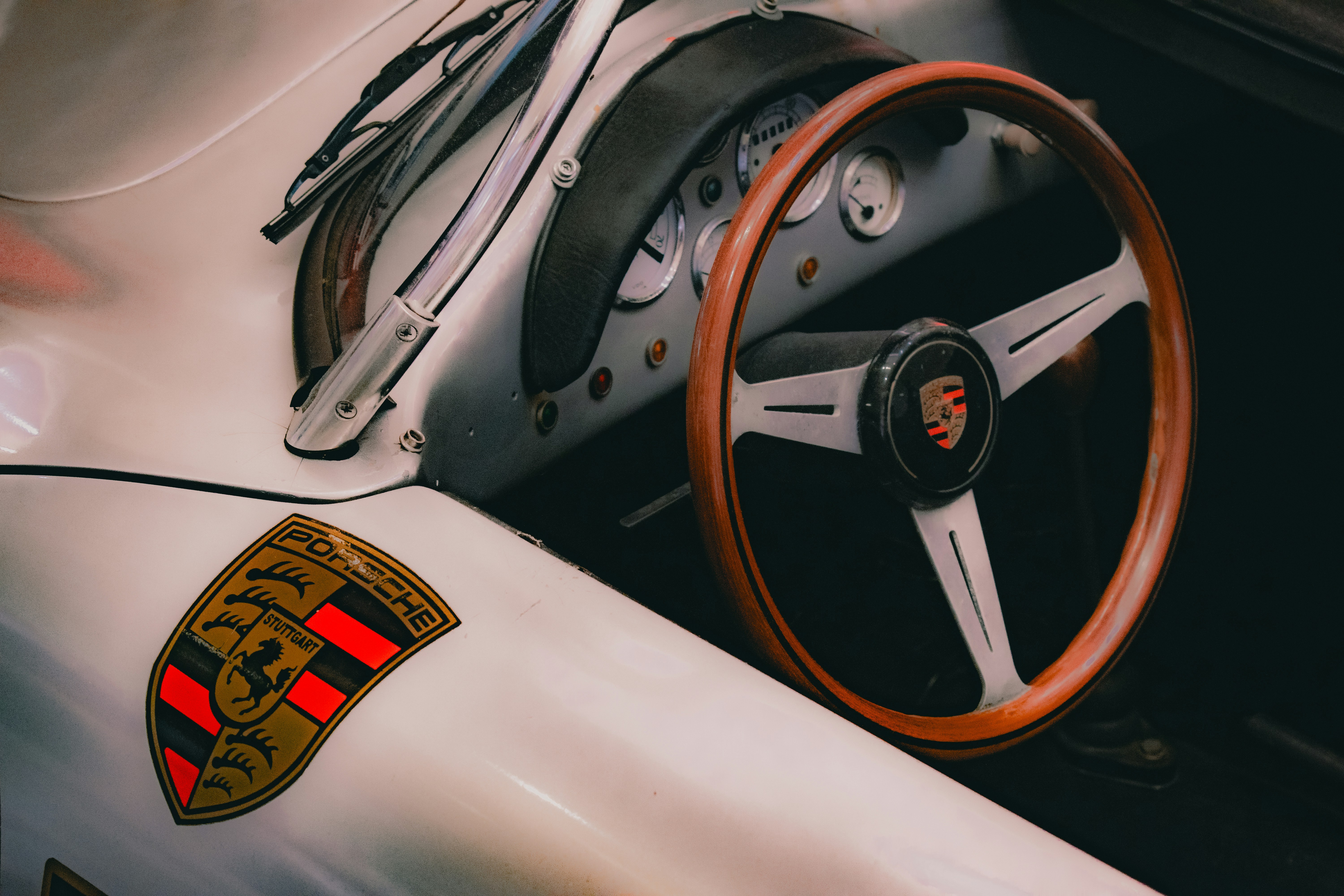 A close up of a steering wheel and dashboard of a race car