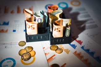A pile of money sitting on top of a table