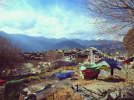A group of tents sitting on top of a hillside