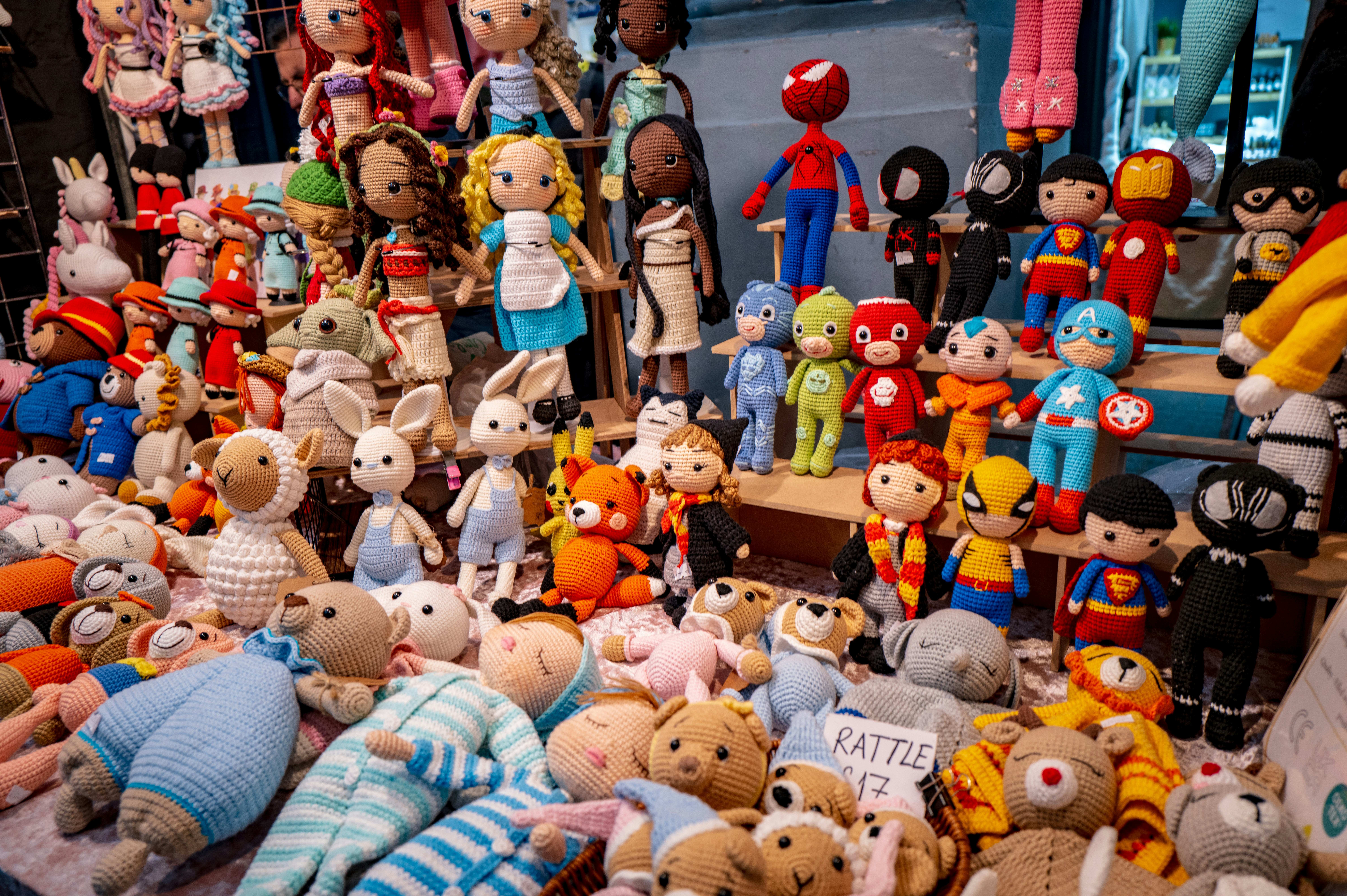 A pile of stuffed animals sitting on top of a floor