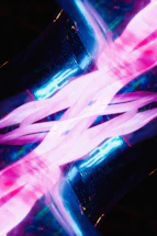 A blurry photo of a pink and blue object