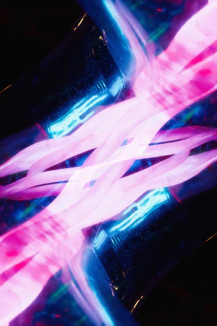 A blurry photo of a pink and blue object