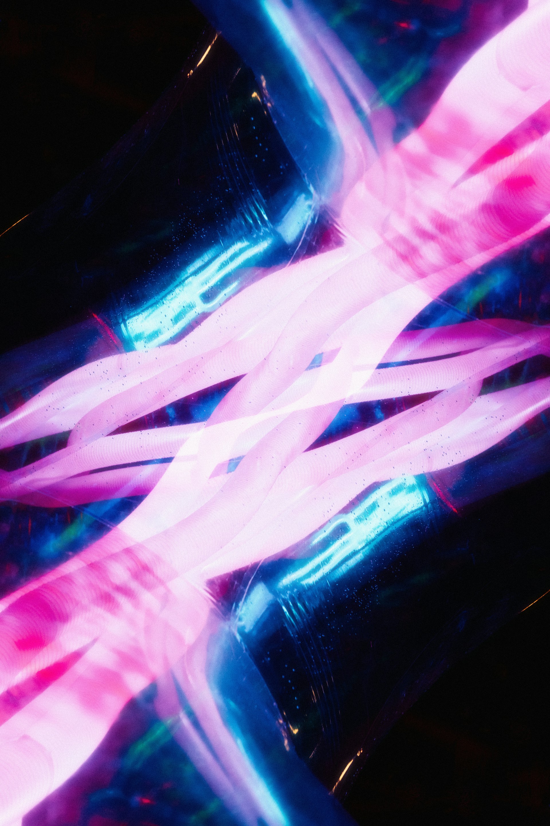 A blurry photo of a pink and blue object