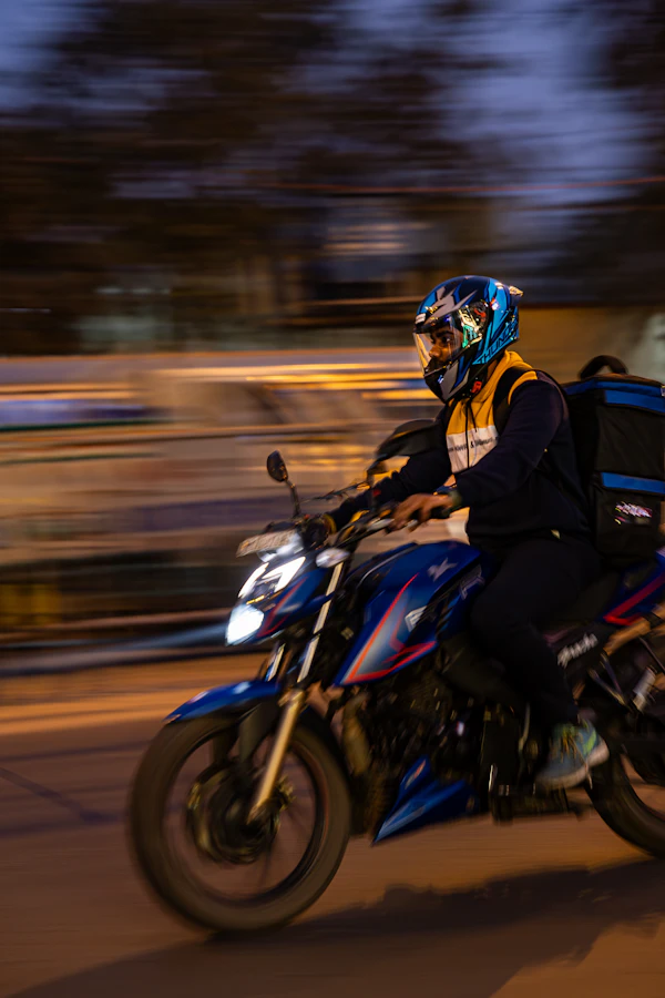 A delivery rider on a motorcycle