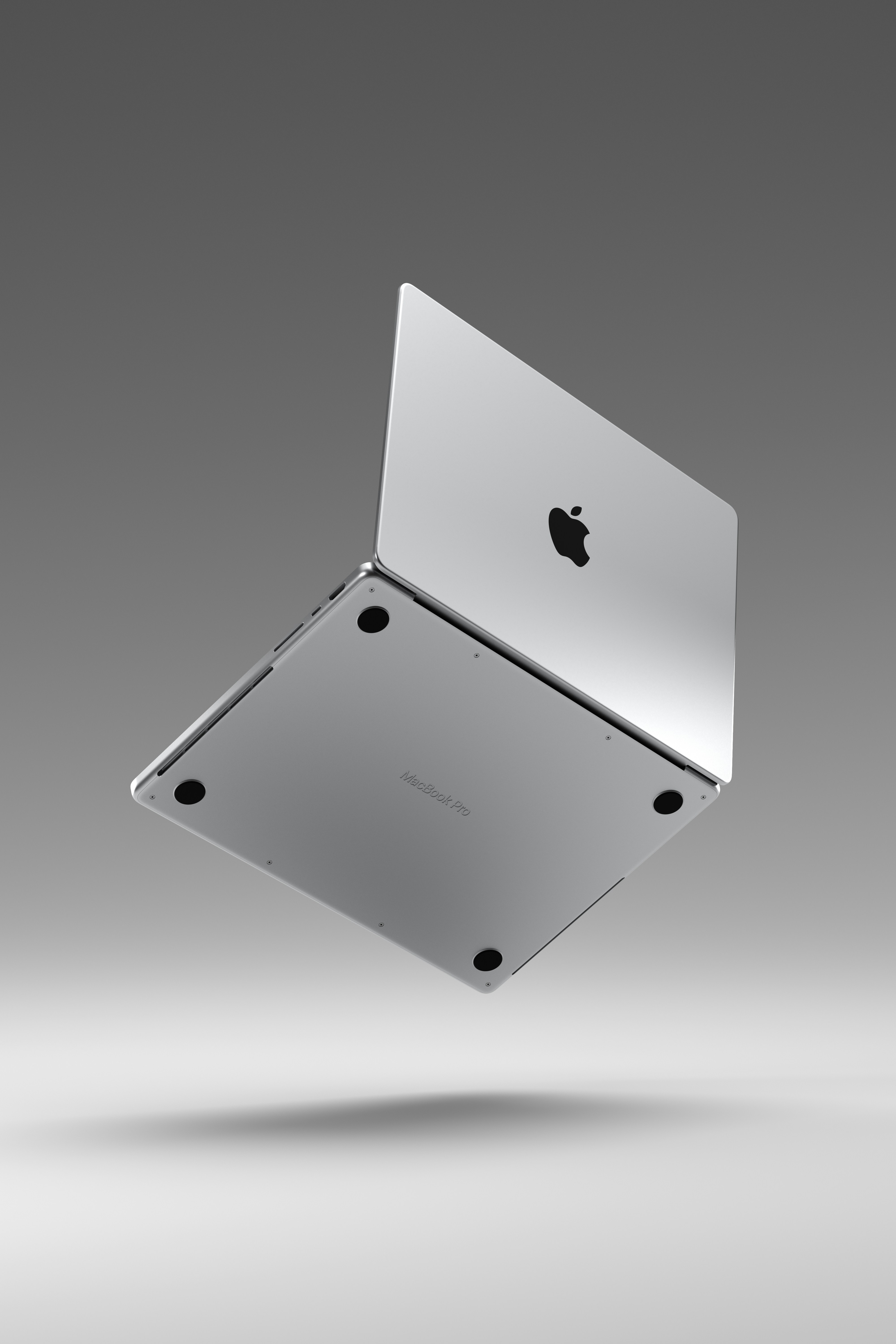 A silver apple computer sitting on top of a table