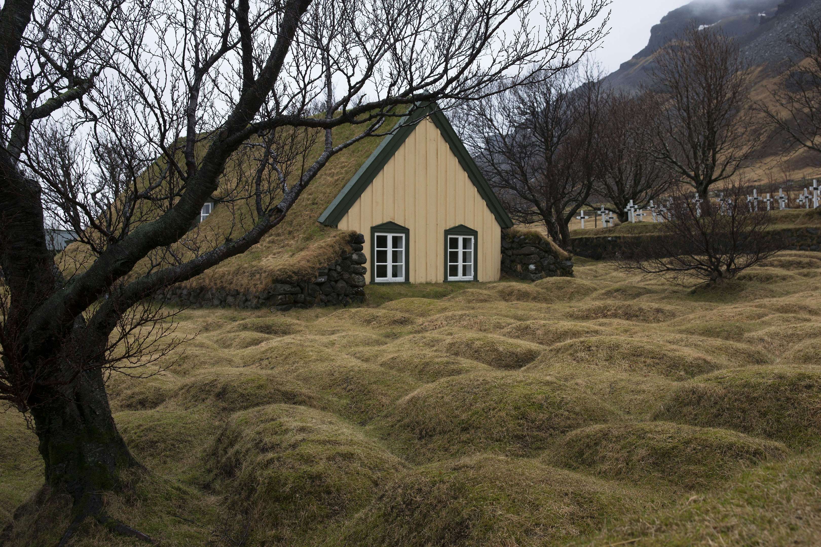 A small house in the middle of a field