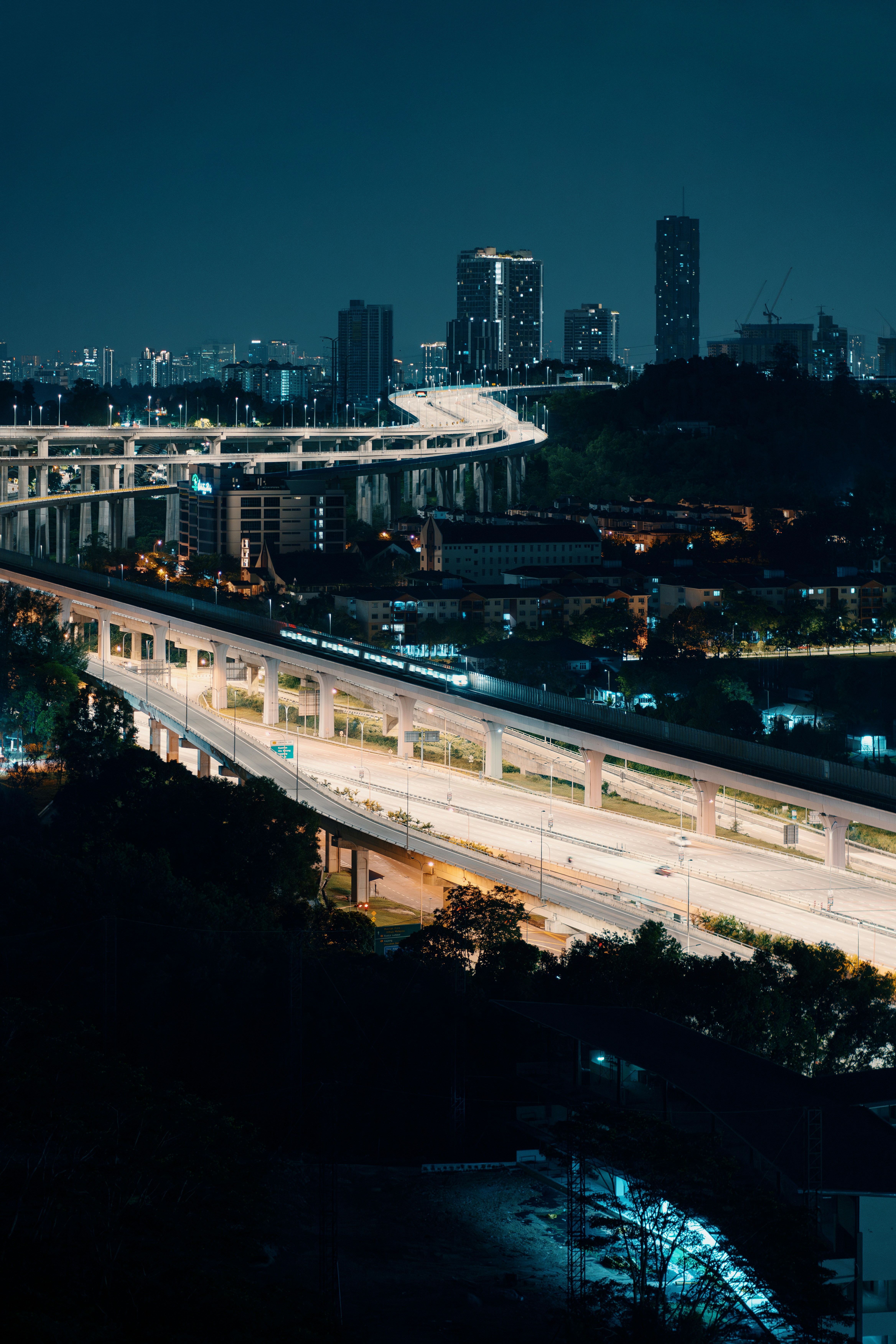 A night view of a highway and a city