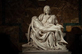 A statue of a woman holding a man