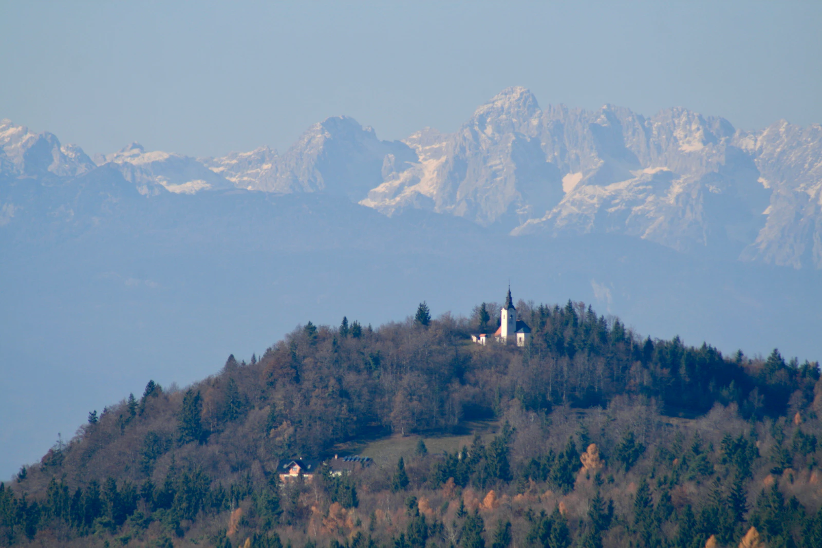 Julian Alps, Slovenia with church and snow-capped mountains