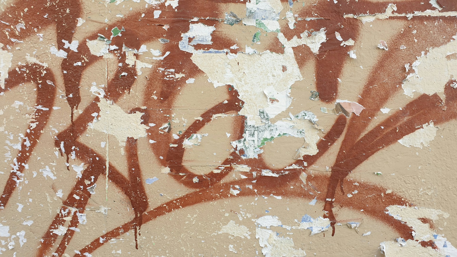 A close up of graffiti on the side of a building