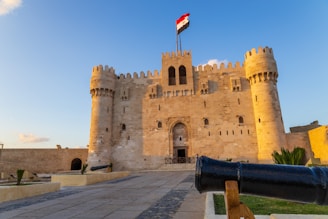 A large castle with a flag on top of it