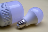 A close up of two light bulbs on a table