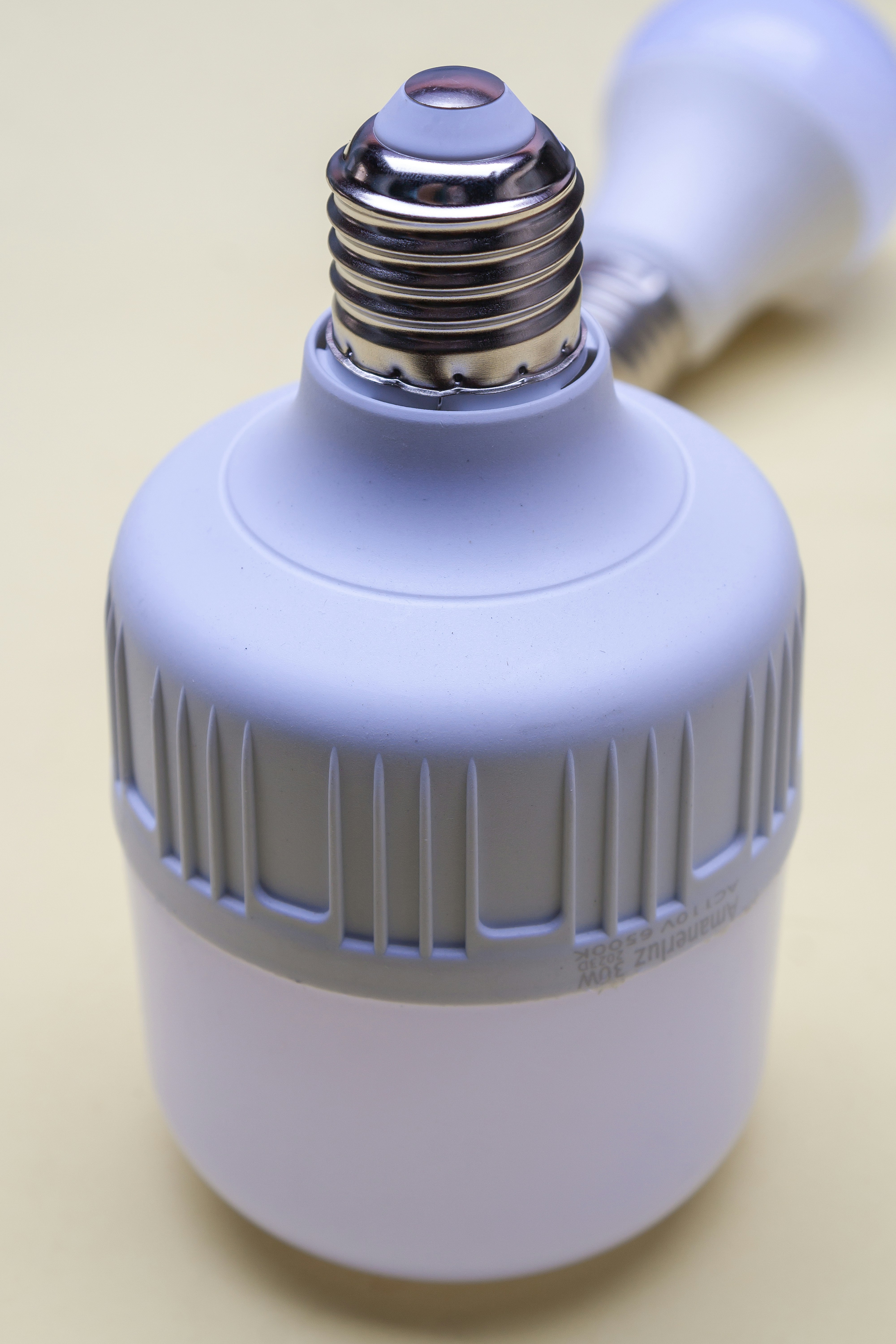 A blue light bulb sitting on top of a table