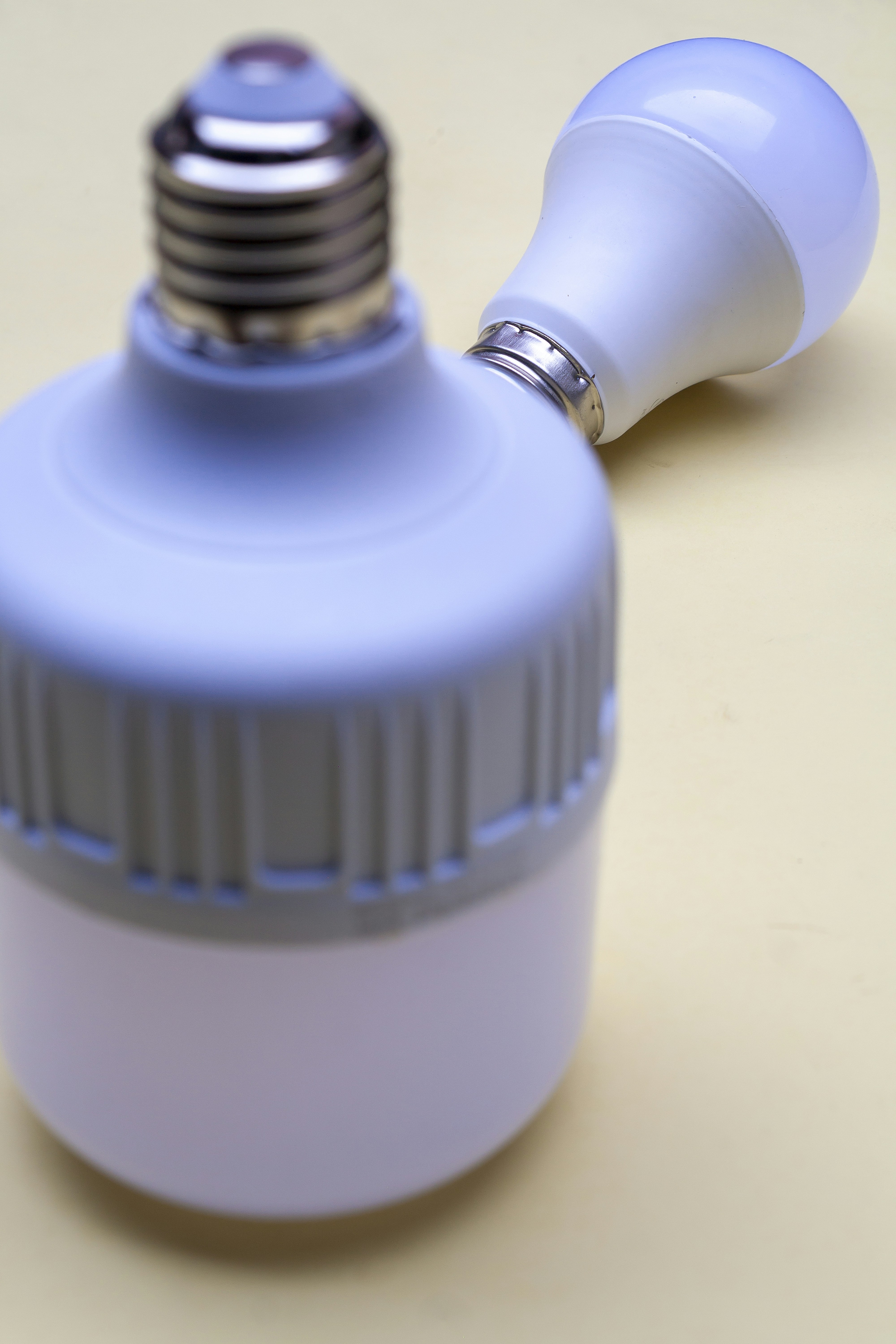 A blue light bulb sitting on top of a table