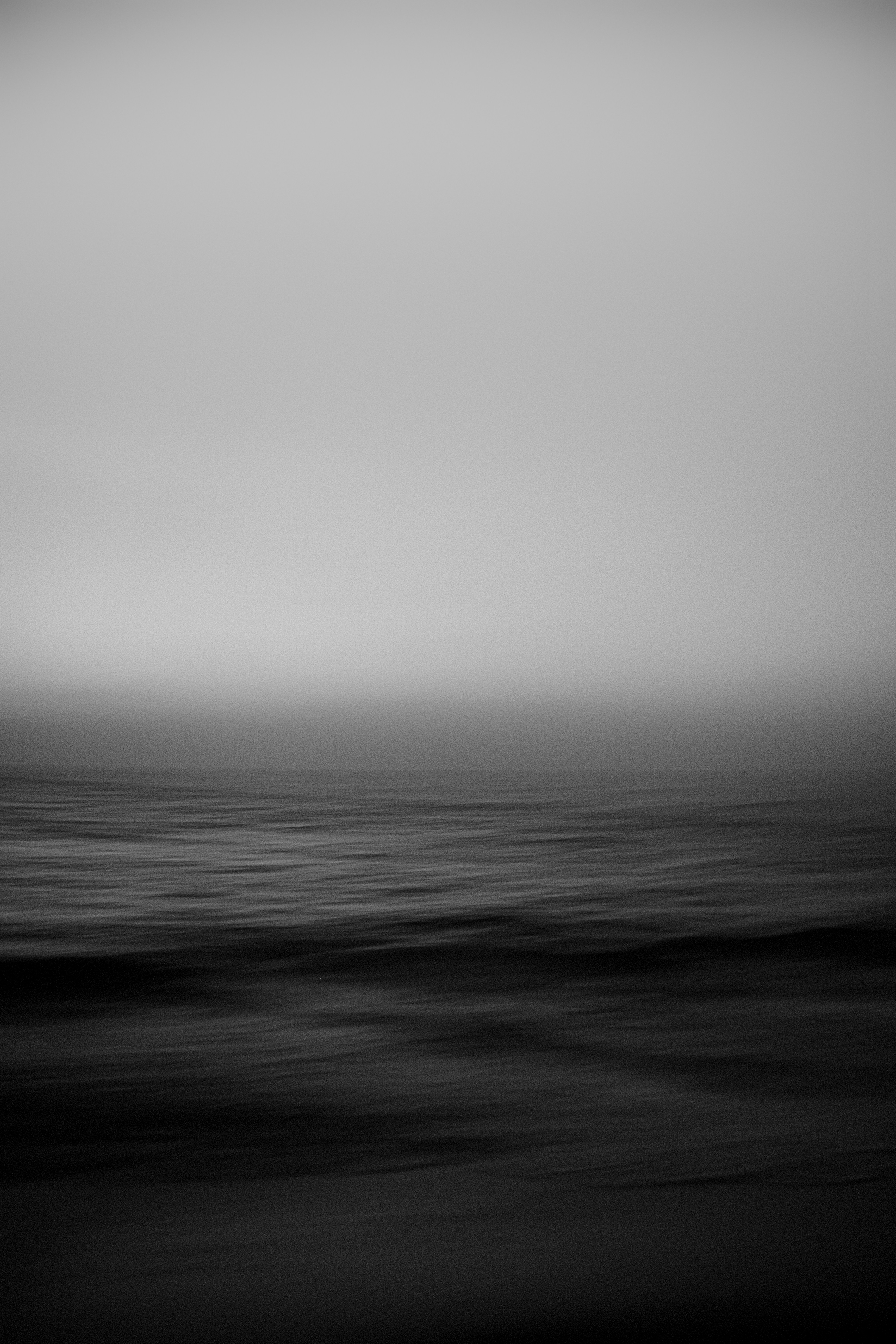 A black and white photo of the ocean