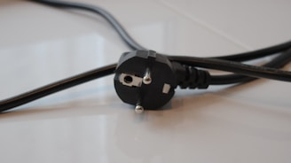 A close up of a power cord on a table