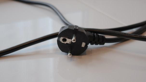 A close up of a power cord on a table