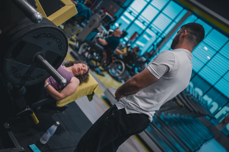 Client working through a controlled machine exercise as Dave watches on