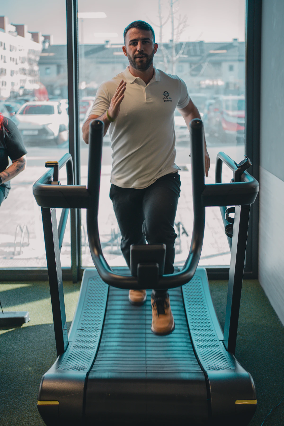 Patient undergoing a cardiac stress test on a treadmill while monitored by EKG.