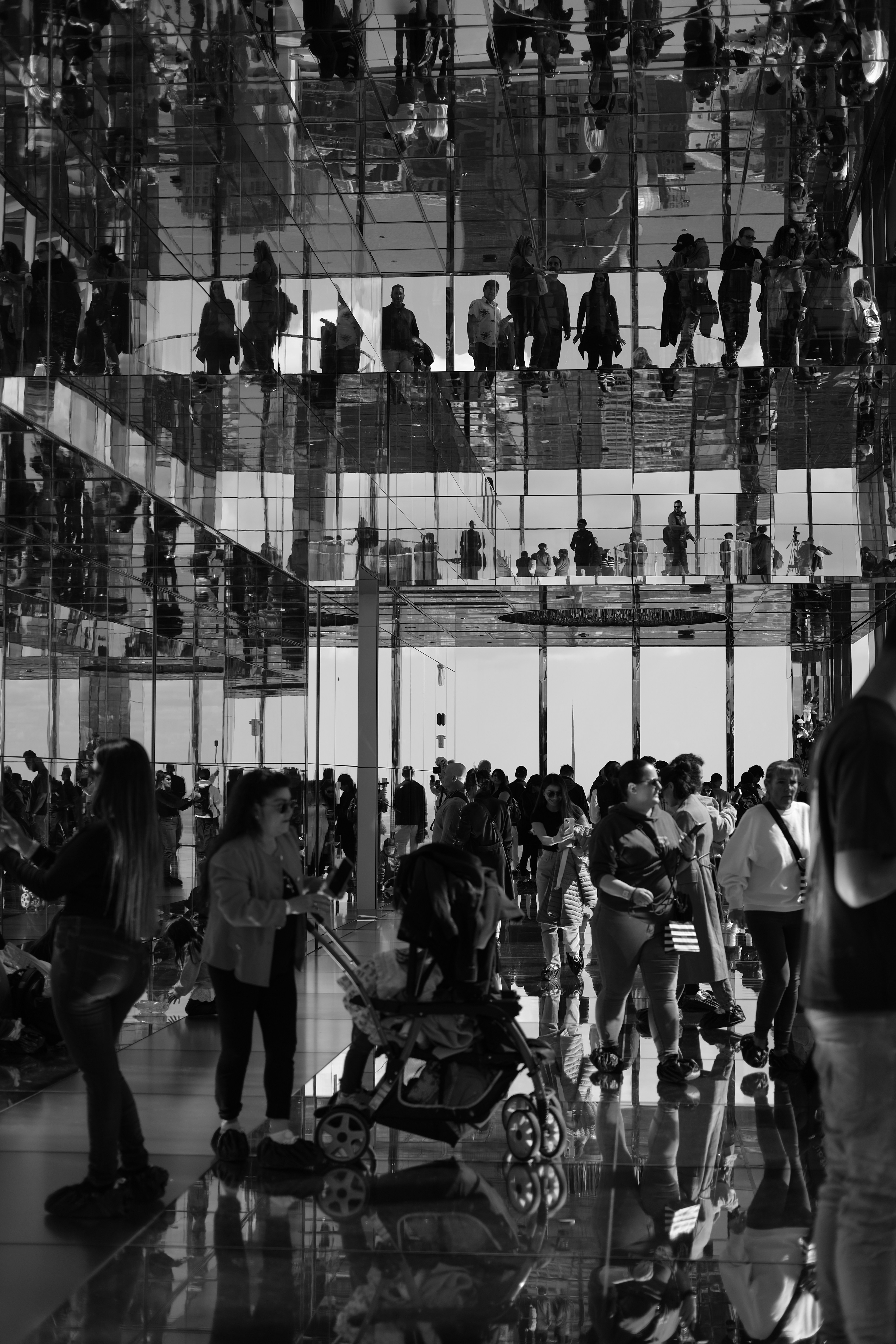 A black and white photo of people in a building