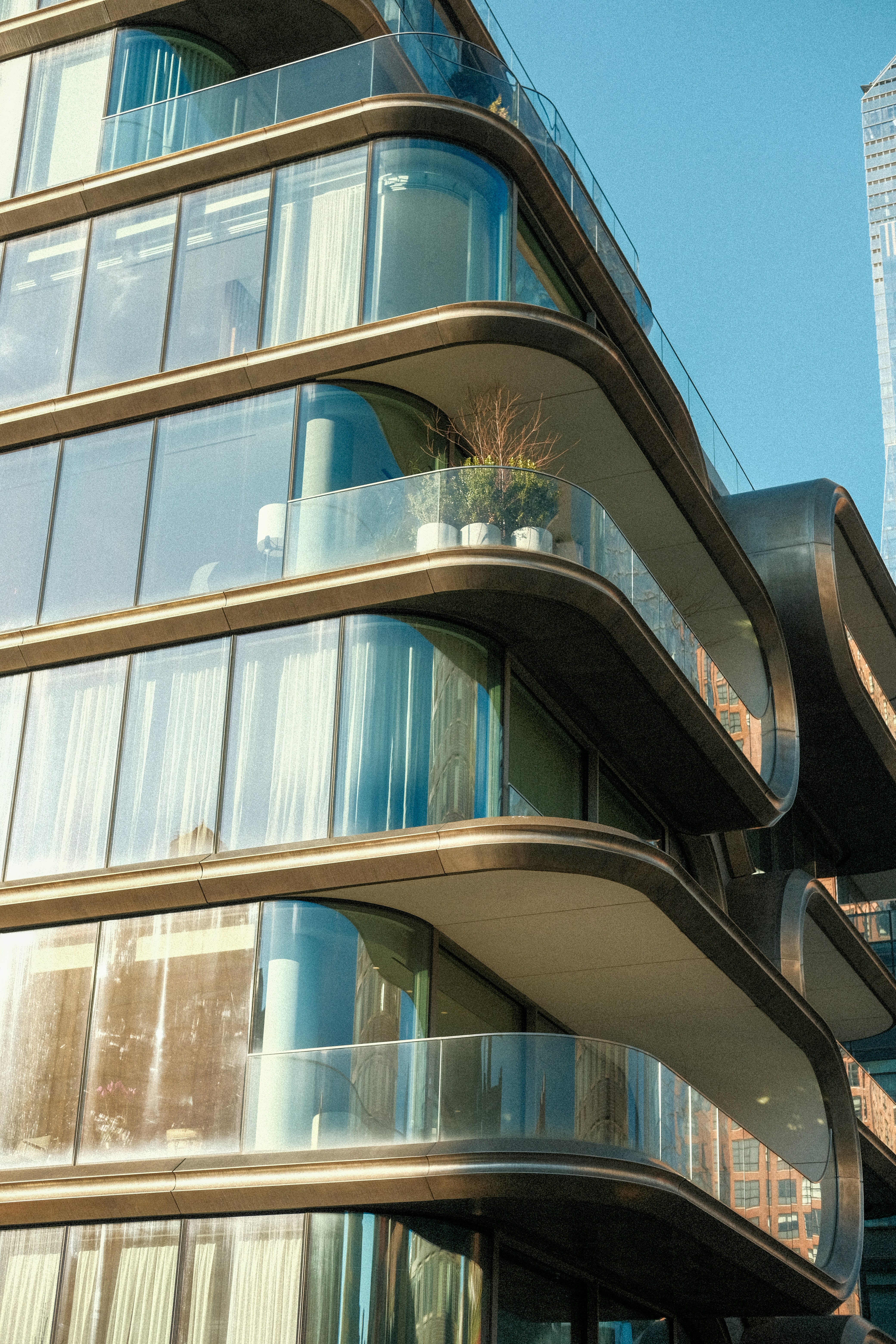 A tall building with lots of windows and balconies